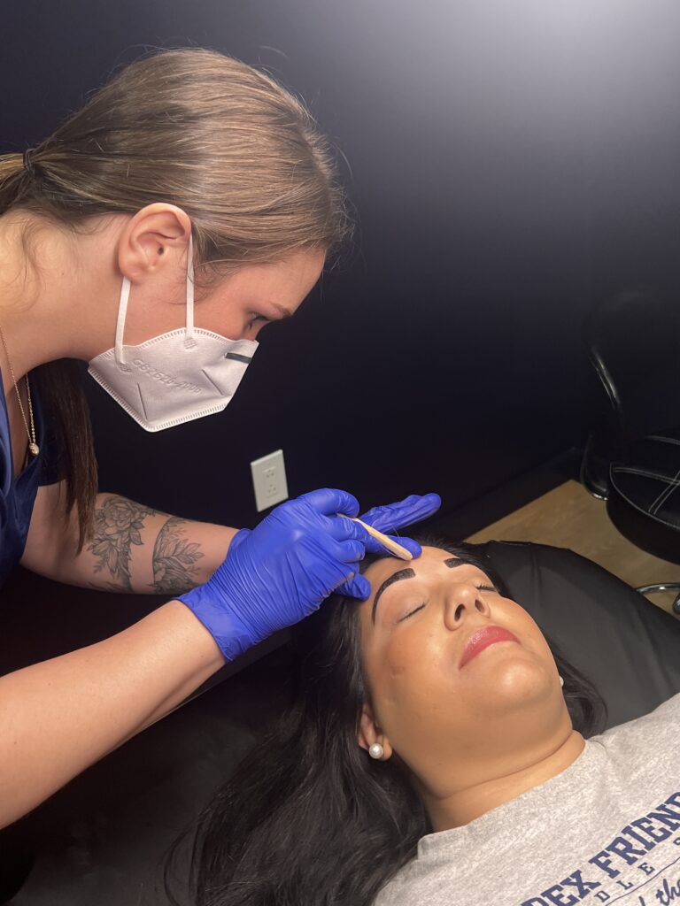 Kelsey performing a brow wax and tint at Smoothe & Co. in Raleigh, NC.