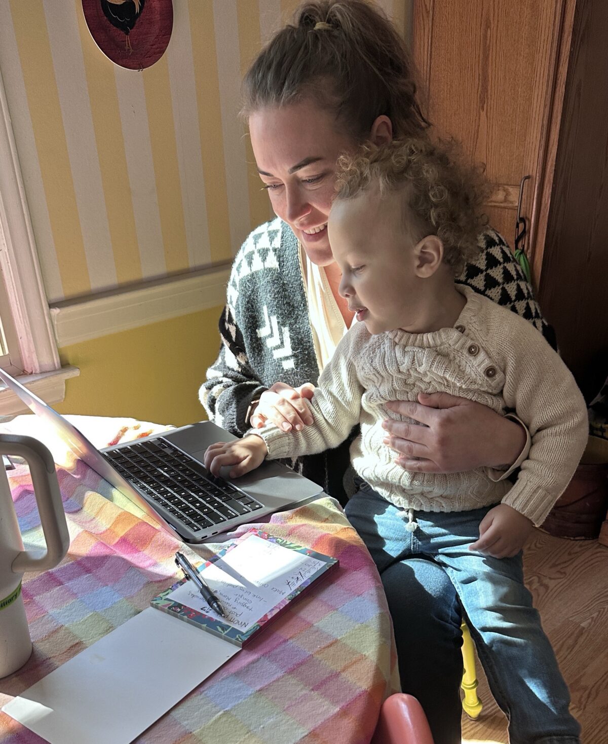 Lindsey and her son Corbin working at the computer in Raleigh, NC.